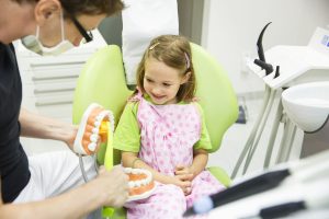 Little girl smiling learning about oral health in Portland, Oregon