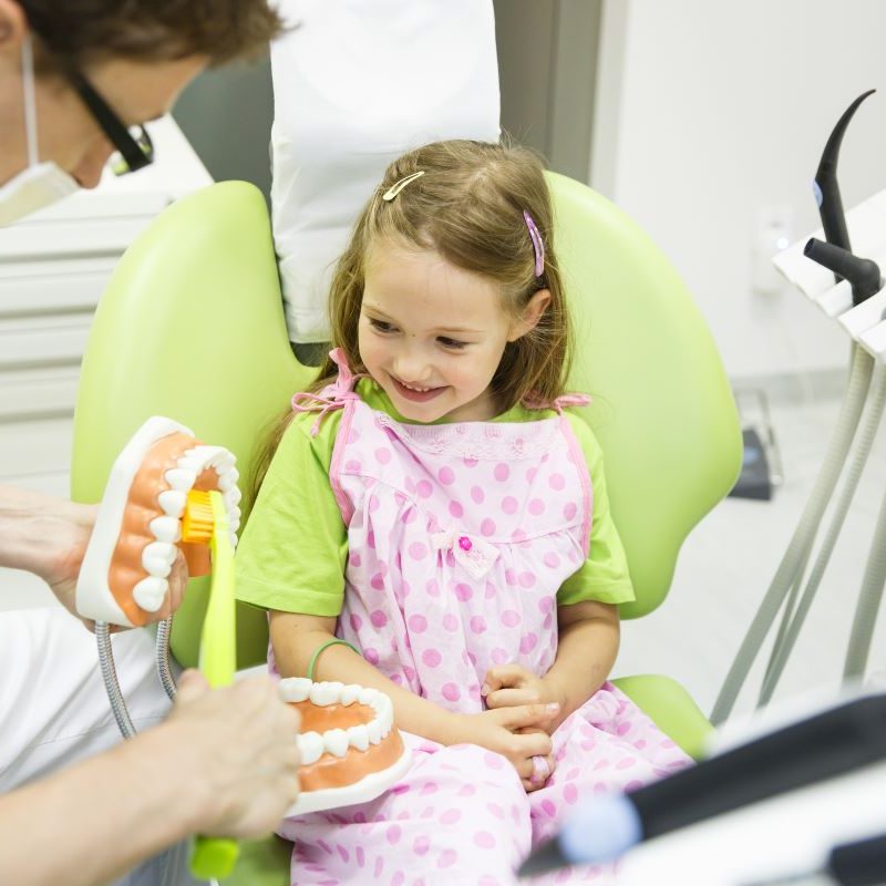 Little girl smiling learning about oral health in Portland, Oregon