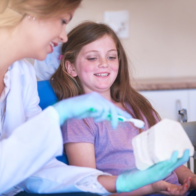 Child learning dental health in Portland, Oregon